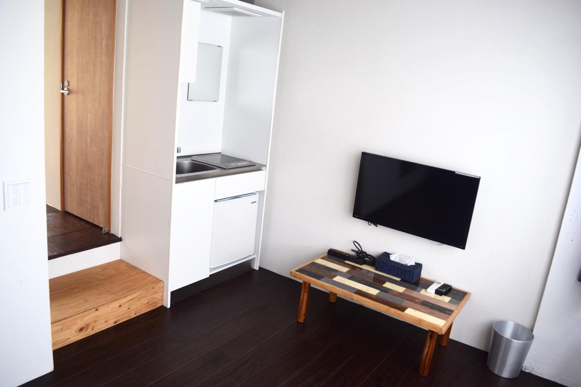 Guest House Golden Mile Hostel Amami Zimmer foto
