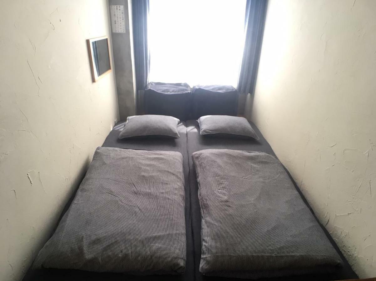Guest House Golden Mile Hostel Amami Zimmer foto